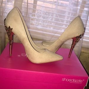 Nude colored heels with gold detailing